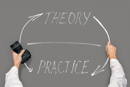 Male photographer with hand drawing sketch about importance of practice and theory balanceの写真素材