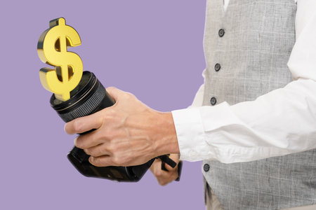 Man with camera and dollar sign, concept of make good money on photographing, the artistry, precision, and financial success that can arise from pursuing ones passion.の写真素材