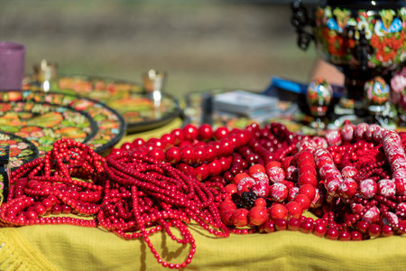 Unique handmade colorful beads necklaces at local craft market in Ukraine. Colorful Ukrainian beads for sale at the national fair counterの写真素材