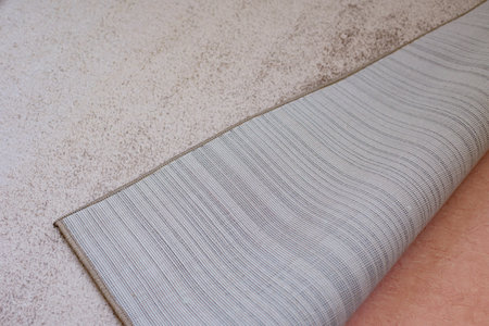 Closeup photo of new carpet on floor in living room after repairの写真素材