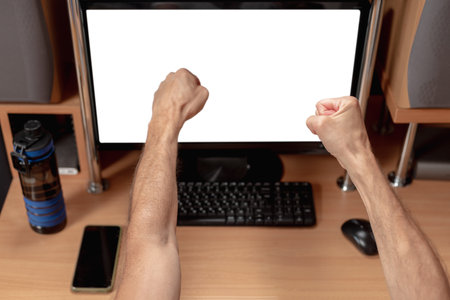 Man having blocked account after hacking attempt. Male viewing monitor with account blocking notification, hands reacting to news on screenの写真素材