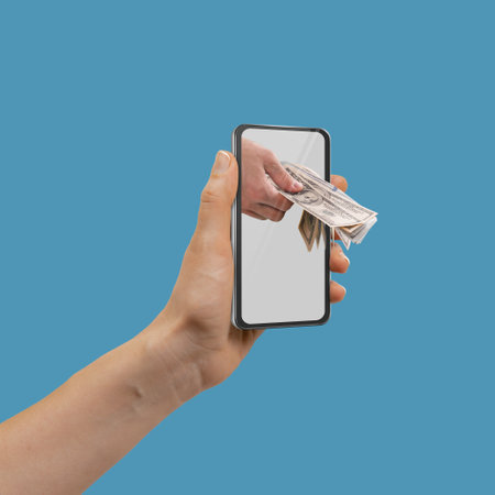 woman doing online payment with credit card and smartphoneの写真素材