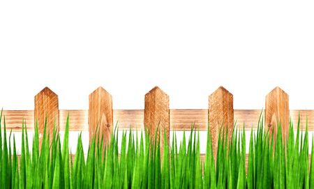 wooden fence with green grassの写真素材
