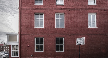 red brick wall building on the streetのeditorial素材
