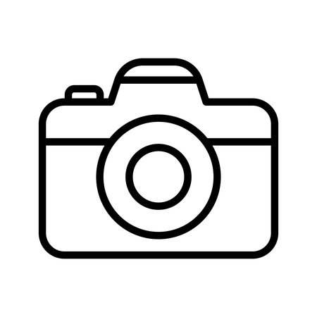 A simple vintage camera icon in outline style, perfect for creative projects in photography, graphic design, and digital arts, conveying nostalgia and simplicity.のイラスト素材