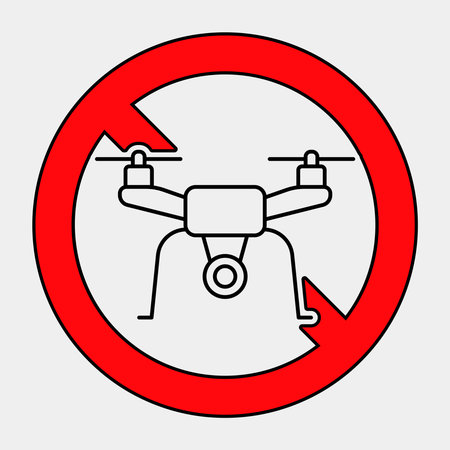 This graphic depicts a no drone zone sign, featuring a drone encircled by a red prohibition symbol. Ideal for safety and regulation-related themes.のイラスト素材