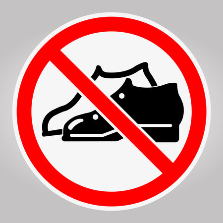 Clear prohibition sign displaying a shoe icon, emphasizing no footwear usage. Ideal for communicating hygiene and safety policies in various spaces.のイラスト素材
