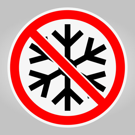 This image shows a no snowflake symbol encircled in red with a gray background. It serves as a visual warning against cold or wintry conditions.のイラスト素材