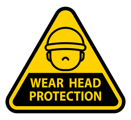 This image features a warning sign promoting the importance of wearing head protection, essential for safety in construction and industrial environments.のイラスト素材