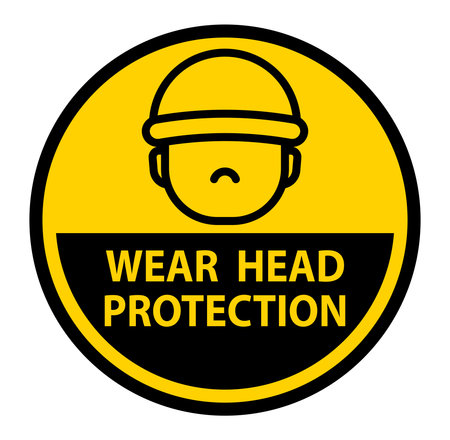 A safety sign featuring a stylized face with a hard hat, emphasizing the importance of head protection in workplace safety protocols.のイラスト素材