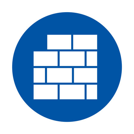 Graphic showing a blue circle icon with a simple brick wall design, suitable for construction and design projects, conveying strength and reliability.のイラスト素材