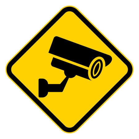 Bold yellow caution sign featuring a security camera symbol to indicate surveillance in the area. Perfect for security awareness and safety communication.のイラスト素材