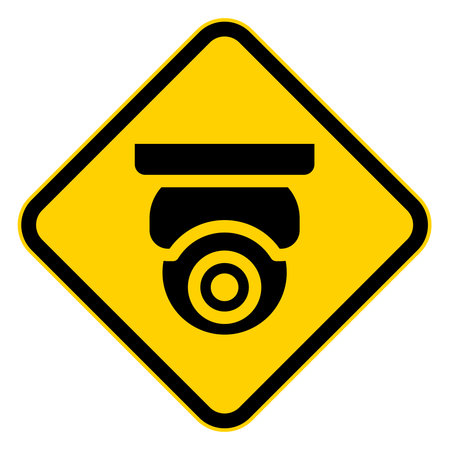 This image features a bold warning sign depicting a surveillance camera on a bright yellow background, emphasizing security and awareness in public spaces.のイラスト素材