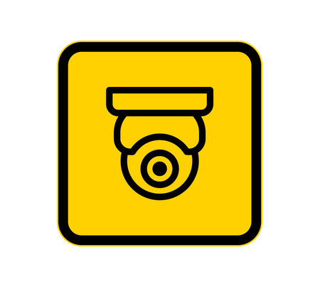 This graphic illustrates a security camera icon on a bright yellow square. Ideal for safety signage,...