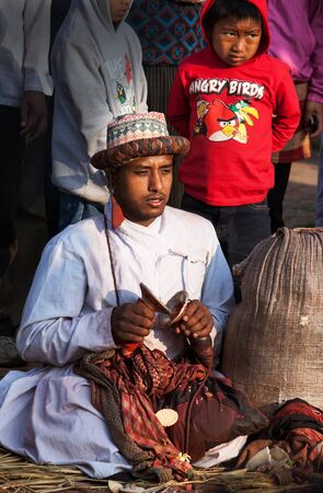 BHAKTAPUR NEPAL APRIL 19 2013: Unknown nepali musician plays small karatalas during the performance of a ritual dance in celebration of Nepali New Year.のeditorial素材