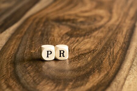 PR word background on wood blocksの写真素材