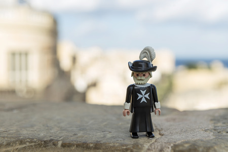Valletta, Malta - October 11, 2016: Playmobil maltese knight with the Grand Harbour in the background. Playmobil are famous construction toys manufactured by the Brandstaetter Group in Germany, are now almost entirely manufactured in Malta.のeditorial素材