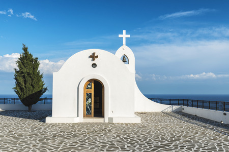 Little white chapel on the hill. Small church near Faliraki, Greek town on the island of Rhodes.の写真素材