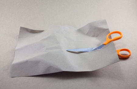 Scissors cutting a paperの写真素材