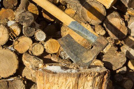 Axe chopping woods, pieces of woods ready for winter home cabin fire