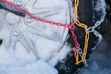 Chains snow for the wheel car, deep snowy winterの写真素材