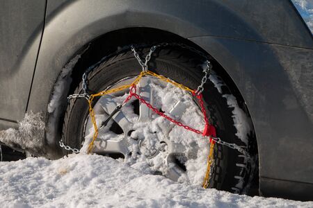 Chains snow for the wheel car, deep snowy winterの写真素材