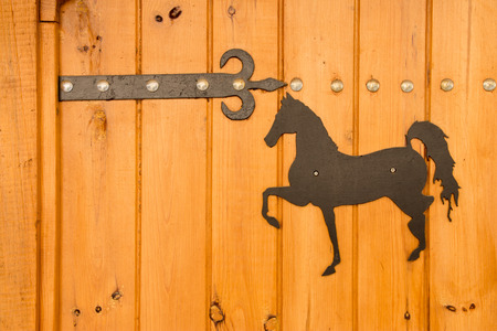 Old wooden vintage traditional door with lock, handles and hingesの写真素材