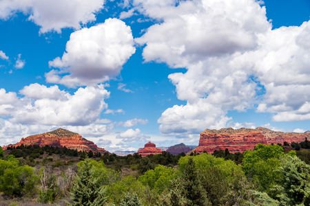 Amazing Red Rock Country near Sedona, Arizona. Displaying colorful sand and limestone rocks and cliffs, with blue sky and white clouds.の写真素材