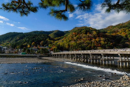 The Togetsukyo Bridge Arashiyama Kyoto Japan in autumnの写真素材