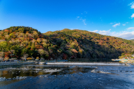 The Togetsukyo Bridge Arashiyama Kyoto Japan in autumnの写真素材