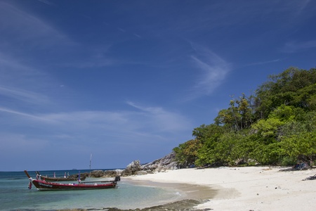 Nice beach with a boat near it  Made in Thailand のeditorial素材
