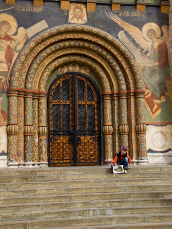 Little boy having a rest on steps of the entrance of Uspenski Cathedral のeditorial素材
