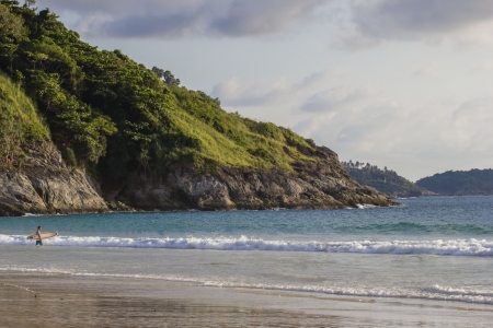 A beach landscape with a surefr on the backview. Thailandの写真素材