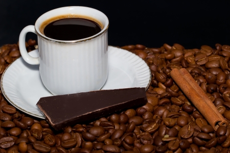Coffee, chocolate and cinnamon on black backgroundの写真素材