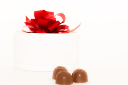 Gift box and chockolate candies isolated on a white background.の写真素材
