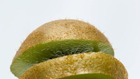 Kiwi fruit slices on a white background.の写真素材