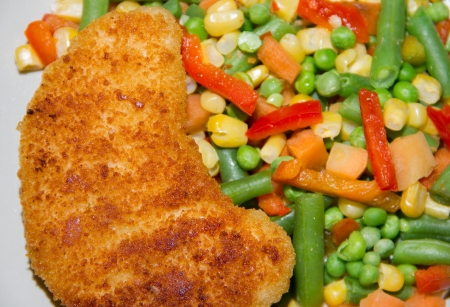 Fried chicken breast with vegetables close up の写真素材