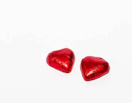 Chocolate hearts on the white background isolatedの写真素材