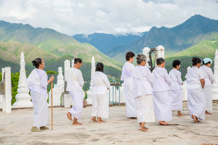Women pilgrims in buddhist temple Wat Phra That Doi Kong Mu. Mae Hong Son, Thailand.のeditorial素材