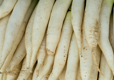 Daikon roots background. Market in Thailand.
