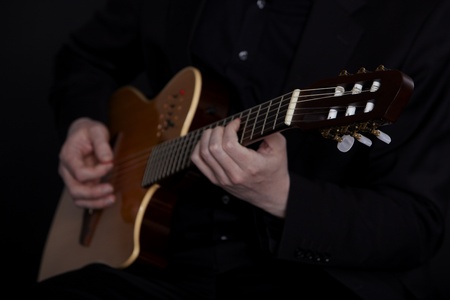 Guitarplayer on blackの写真素材