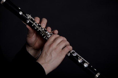 Clarinet player in front of black backgroundの写真素材