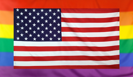 LGBT movement concept with real textile flag of USA placed within a blurred rainbow flag backgroundの写真素材