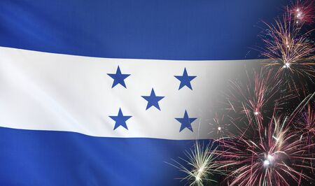 Textile flag of Honduras with firework seamless close up with wind waves in the real fabricの写真素材