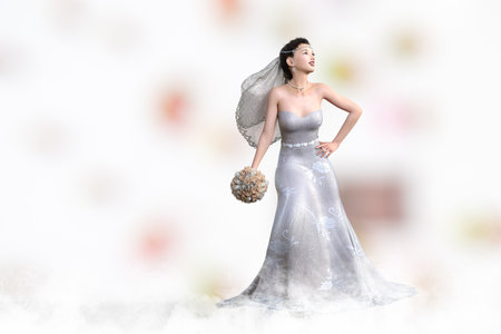 A pretty bride holding her bouquet and looking into the distance.3D illustration 3D renderingの写真素材