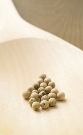 White pepper corns on a wooden spoon, macroの写真素材