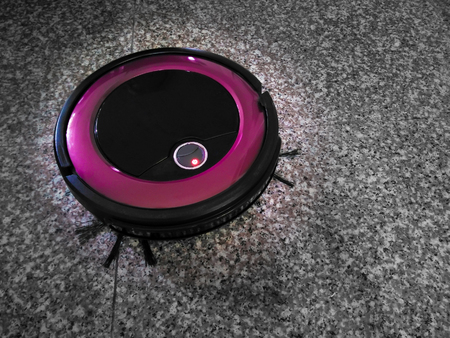 The Ever So Helpful Robotic Auto Vacuum Cleanerの写真素材