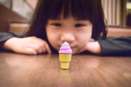 Child Full of Anticipation of the new Toy Ice Creamの写真素材