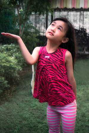 Girl Posing in The Rain in a Gardenの写真素材