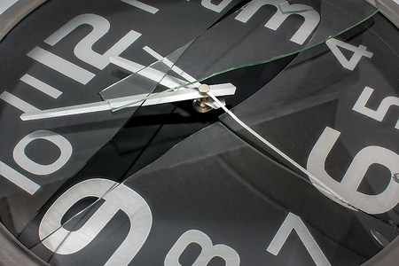 Black and Silver Wall Clock with Broken Glassの写真素材